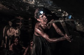Miner Mohammad Ismail digs in a coal mine in Choa Saidan Shah, Punjab province